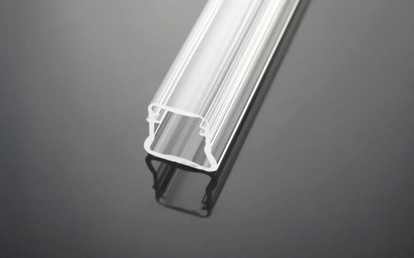 Clear extruded acrylic profile with a channel running along its length