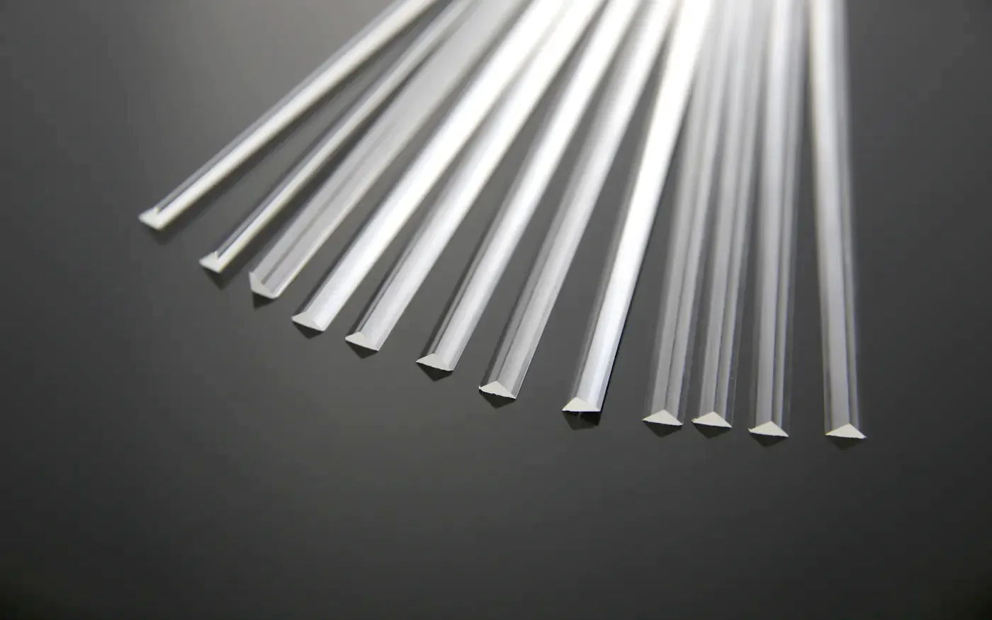 Clear acrylic triangle bar in several section sizes, fanned out