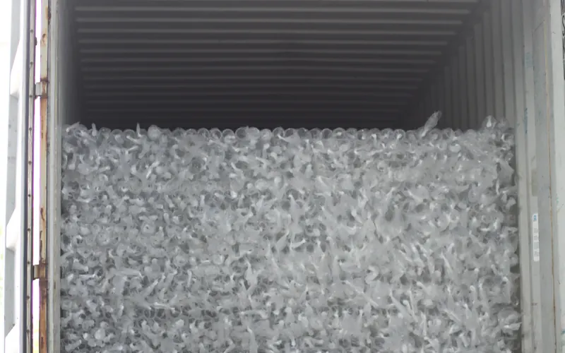 Container being loaded with bundled acrylic tube at the factory