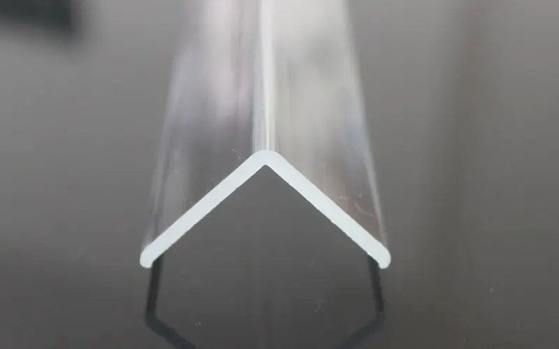 End view of a clear corner guard showing the 90-degree L section