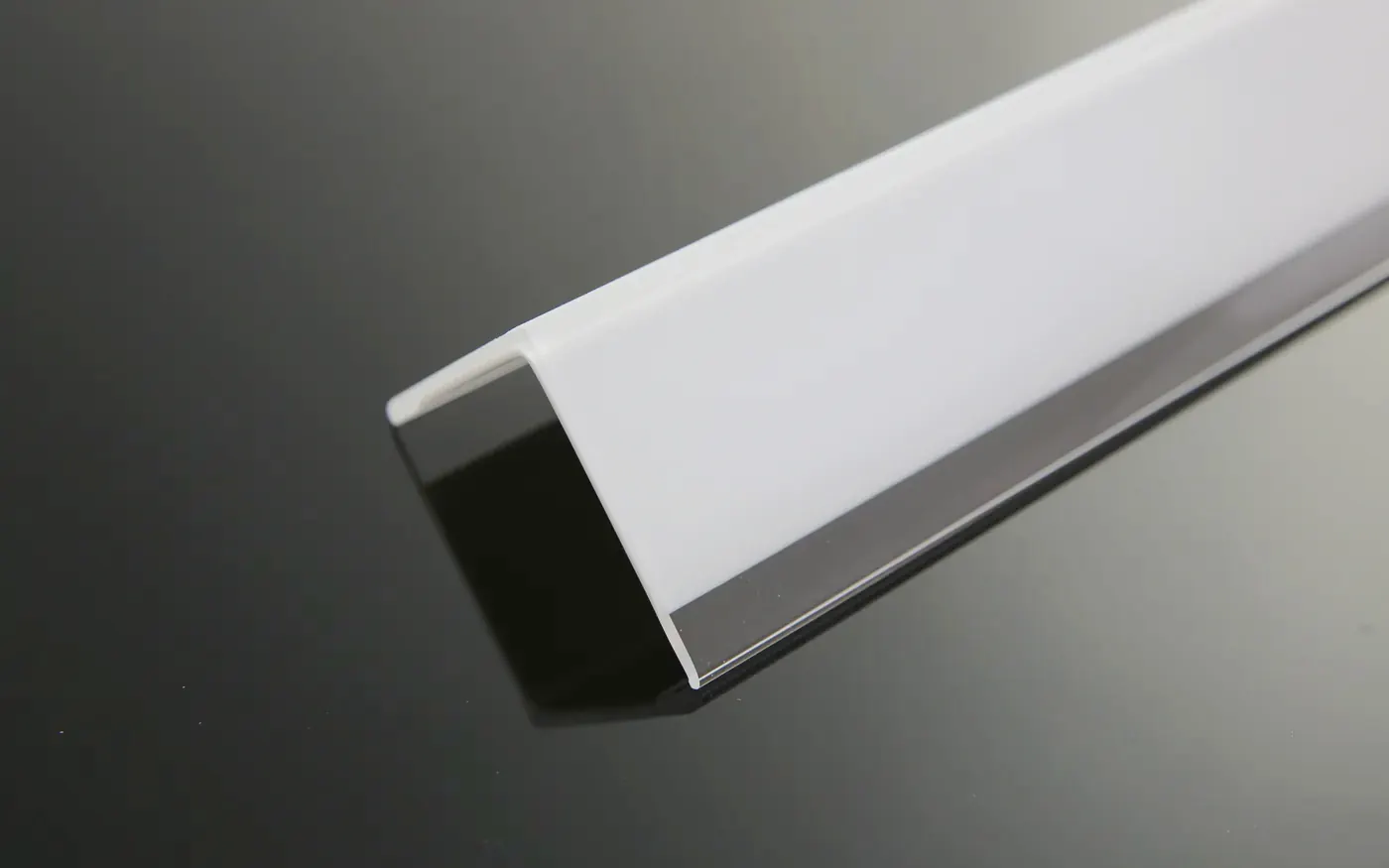 White plastic wall corner guard, angled view showing the L-shaped section