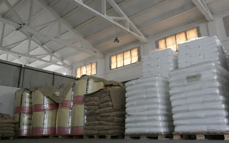 Pallets of raw acrylic and polycarbonate resin in the material store