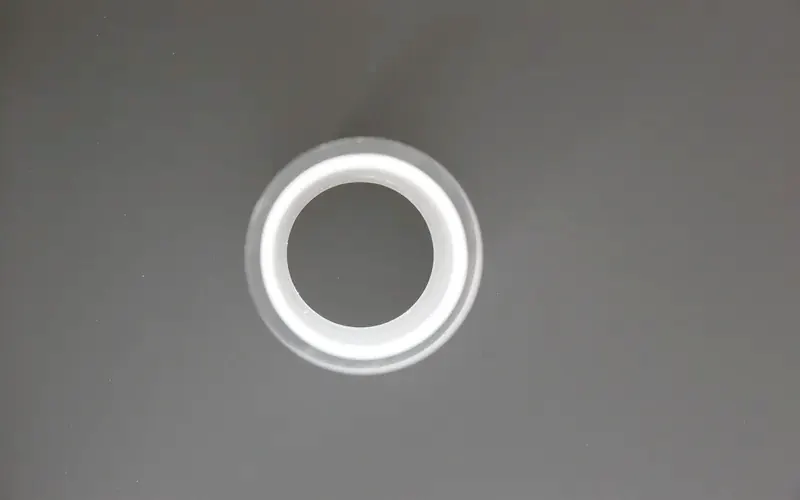 Opal acrylic section seen end-on against a dark background