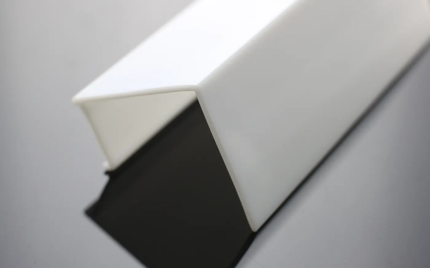 Extruded cover profile in a solid opaque colour