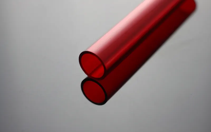 Two red translucent acrylic tubes